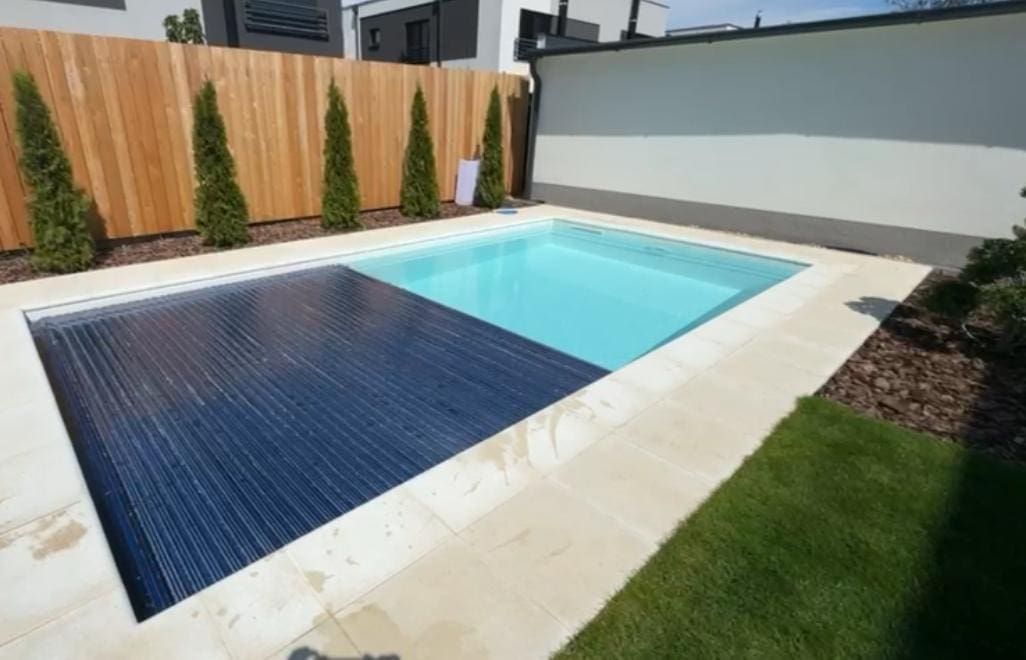 Fibreglass pool with integrated electric cover